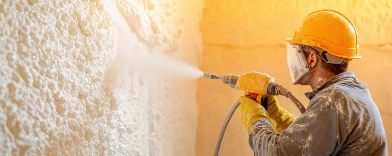 Foam insulation being applied in a construction project